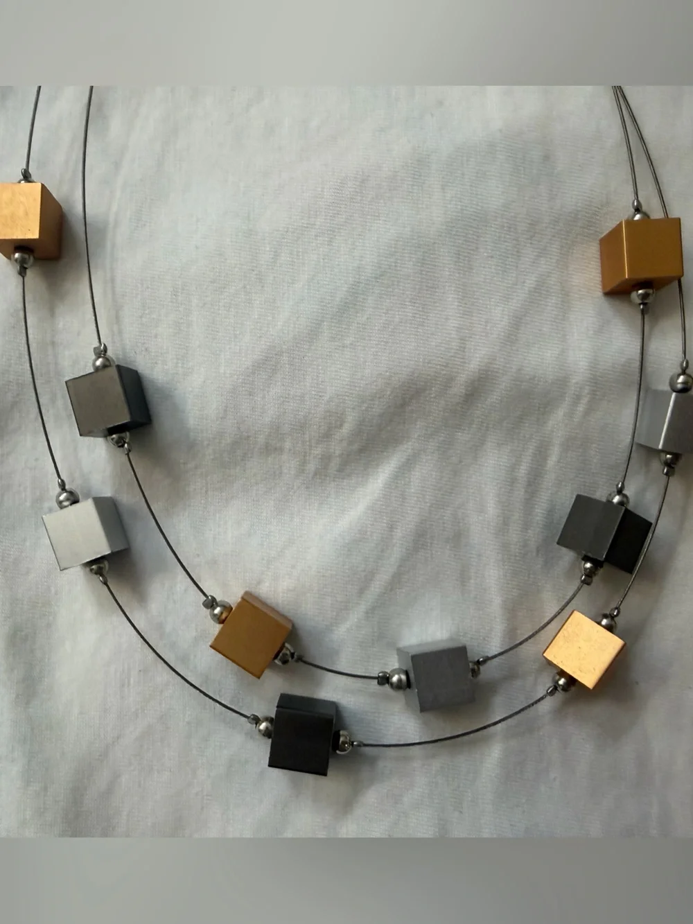 Modern Geometric Cube Necklace in Gold, Silver, and Black